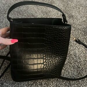 Black bucket bag never used
